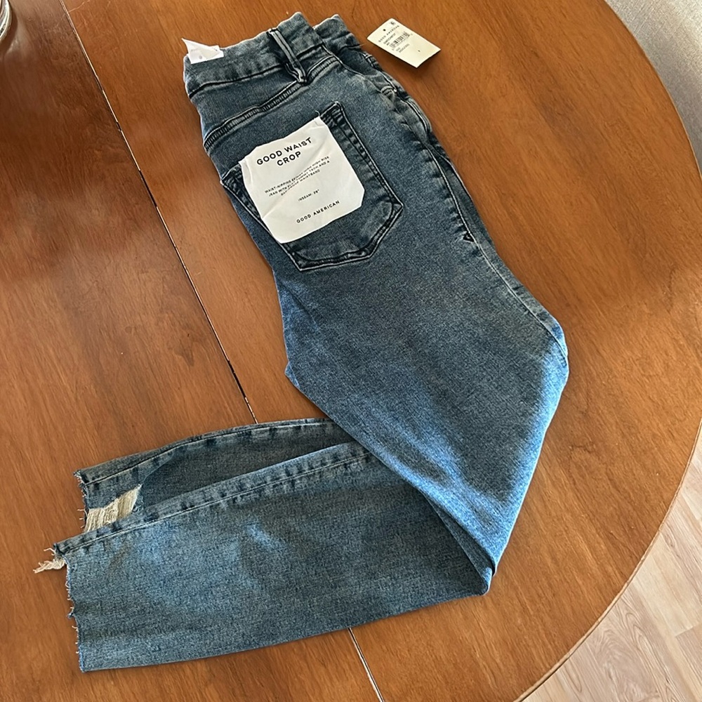 BNWT Good American Good Waist crop jeans with distressing.